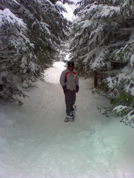 Corey Snowboarding through the glades at (Hunter?) image